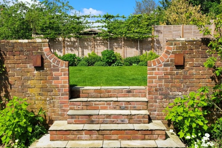 Ready for entertaining - steps up to the new part of the garden inviting you to explore